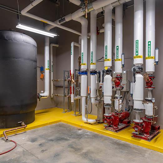These glycol pipes and pumps serve the variable air velocity (VAV) system for office areas at Evergy Emporia Service Center.