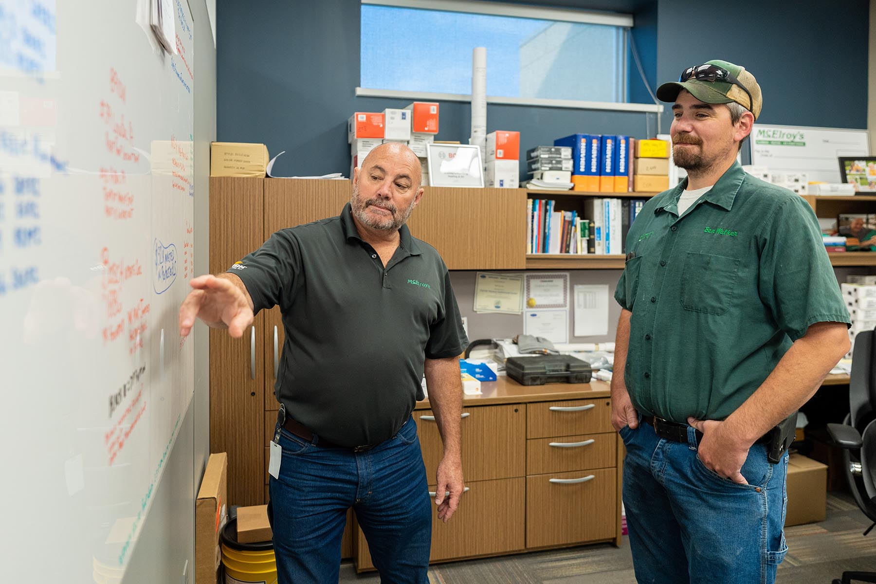Greg Hunsicker, leader of McElroy’s residential HVAC department, and Ben Walker, McElroy’s residential HVAC technician, discuss current installation projects.