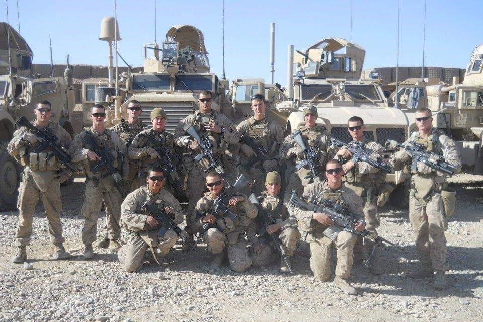 Nick Newsom, U.S. Marine Corp E-4 Corporal, far left, with the squad he was a member of in Afghanistan.