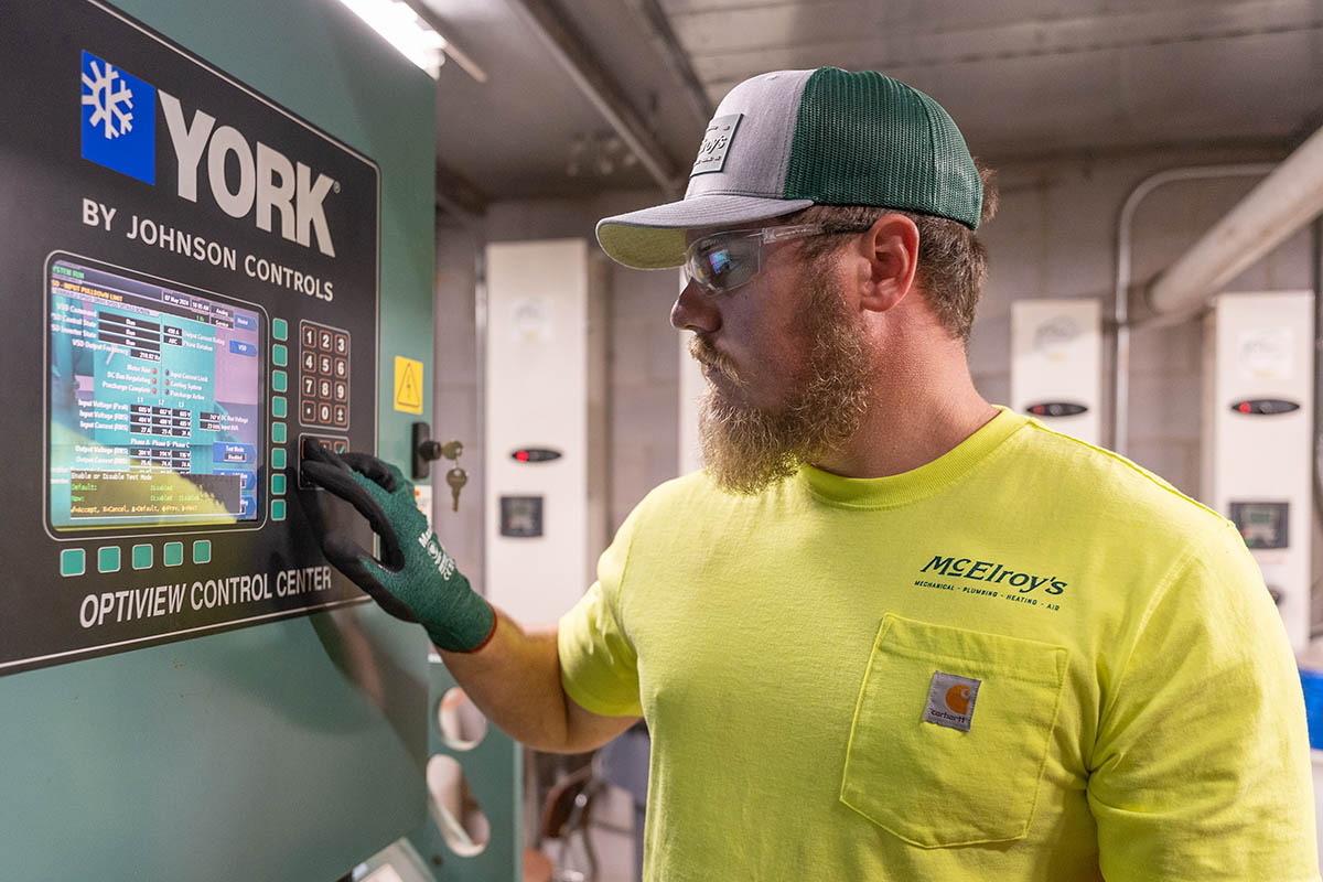 McElroy’s commercial HVAC service technician, Bobby Millard, reviews real-time HVAC-system operating data.