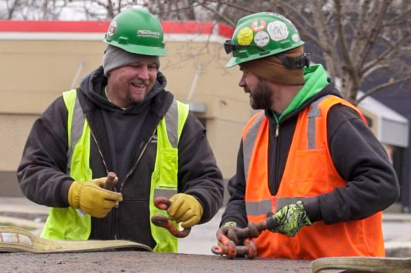 Preston Bond, McElroy’s commercial construction project supervisor, works on a job with McElroy’s technician Brent Eisenbarth.