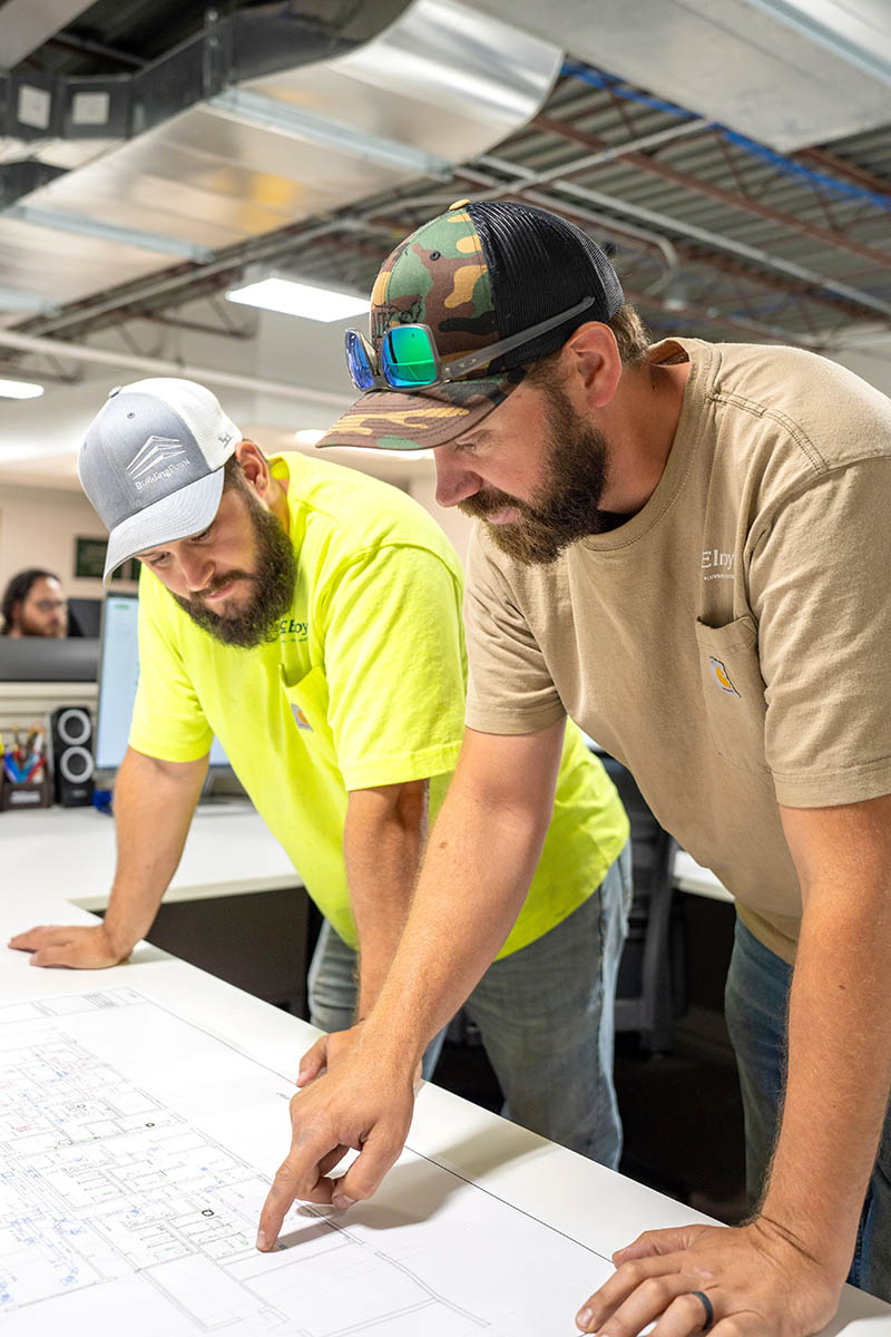 Brent Eisenbarth, McElroy’s commercial construction CAD/BIM designer, works with Joey Towle, McElroy’s fabrication shop manager.