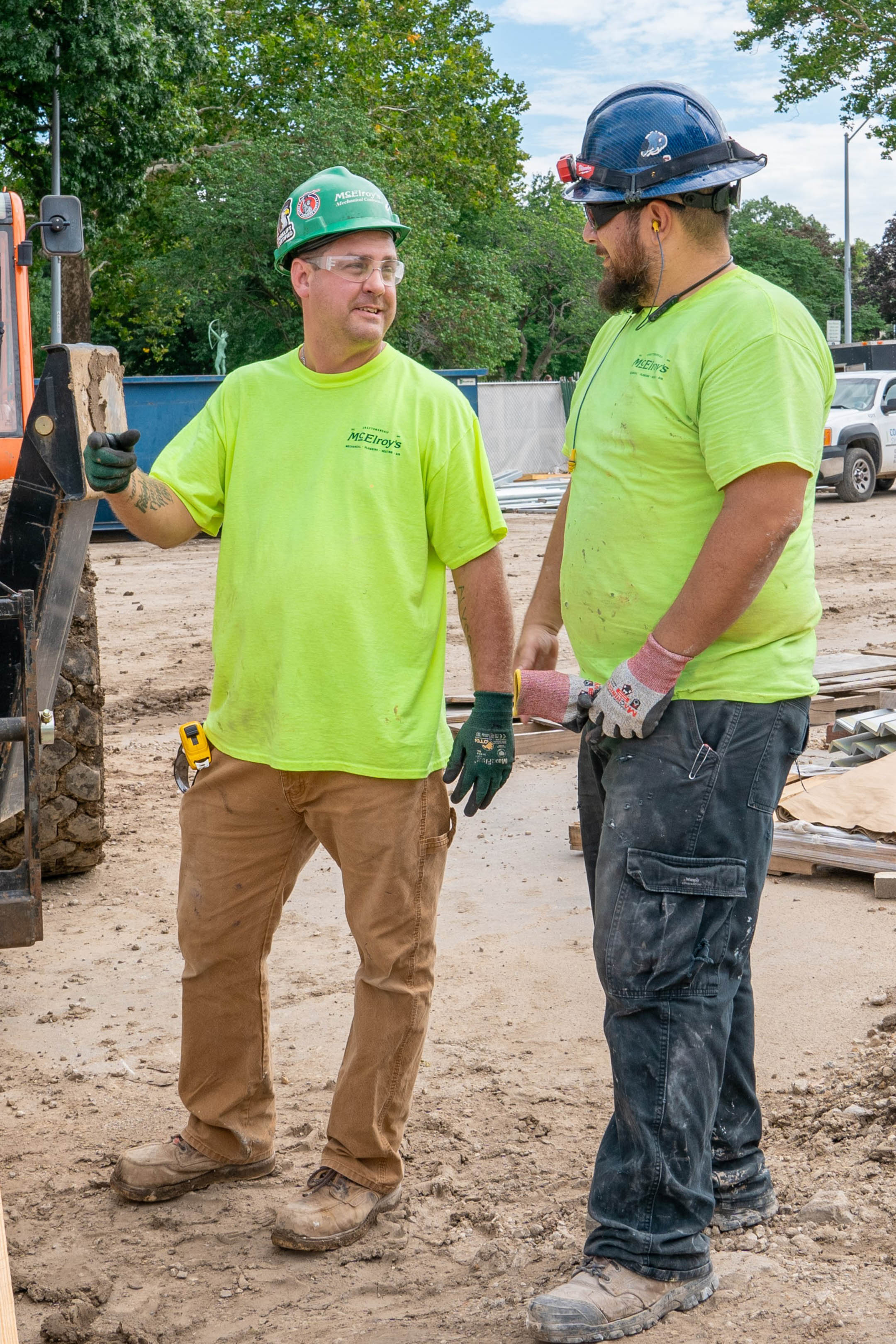 Dusty Bergquist, McElroy’s plumbing/pipefitting foreman, discusses a project with Chuck Mercado, McElroy’s sheet metal foreman.